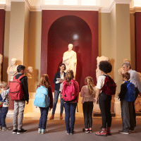 Children learning about ancient sculptures by Visiting Museums